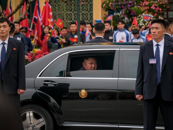 LANG SON, VIETNAM - FEBRUARY 26:  Kim Jong-un waves from his car after arriving by train at Dong Dang railway station near the border with China on February 26, 2019 in Lang Son, Vietnam. North Korea's leader Kim Jong-un arrived in Vietnam for the first time on Tuesday as preparations continue in Hanoi for the summit with U.S President Donald Trump in Hanoi later this week. Reports have indicated that both leaders could agree on a joint statement declaring an end to the 1950-53 Korean War while denuclearization of the Korean Peninsula and ending international sanctions against Pyongyang is expected to be discussed during the summit. (Photo by Linh Pham/Getty Images)
