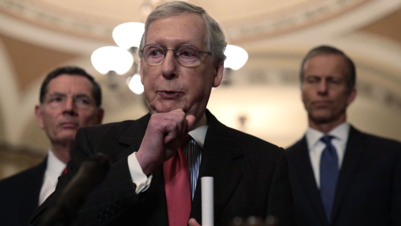 WASHINGTON, DC - FEBRUARY 05:  U.S. Senate Majority Leader Sen. Mitch McConnell (R-KY) (C) speaks to members of the media as Sen. John Barrasso (R-WY) (L) and Senate Majority Whip Sen. John Thune (R-SD) (R) listen after a weekly Senate Republican Policy Luncheon at the U.S. Capitol February 5, 2019 in Washington, DC. Senate GOPs held the weekly policy luncheon to discuss Republican agenda.  (Photo by Alex Wong/Getty Images)