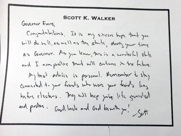 This March 4, 2019 photo shows a hand written note that former Wisconsin Gov. Scott Walker left for his successor, Tony Evers just before he left office in January. Evers on Monday released the note after initially refusing an Associated Press open records request for the document. (AP Photo/Scott Bauer)