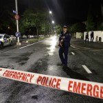 A policeman patrols at a cordon near a mosque in central Christchurch, New Zealand, Friday, March 15, 2019. Multiple people were killed in mass shootings at two mosques full of worshippers attending Friday prayers on what the prime minister called "one of New Zealand's darkest days," as authorities detained four people and defused explosive devices in what appeared to be a carefully planned attack. (AP Photo/Mark Baker)