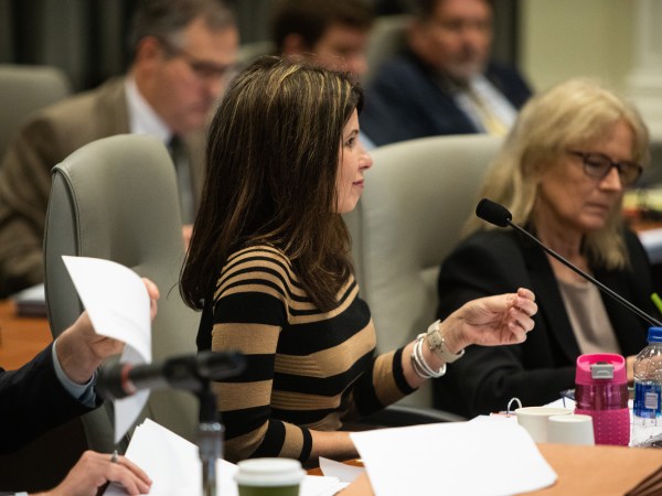 Kim Westbrook Strach, executive director of the Bipartisan State Board of Elections & Ethics Enforcement, questions Mark Harris during the fourth day of a public evidentiary hearing on the 9th Congressional District's voting irregularities investigation on Thursday, Feb. 21, 2019, at the North Carolina State Bar in Raleigh, N.C. (Travis Long/Raleigh News & Observer/TNS)