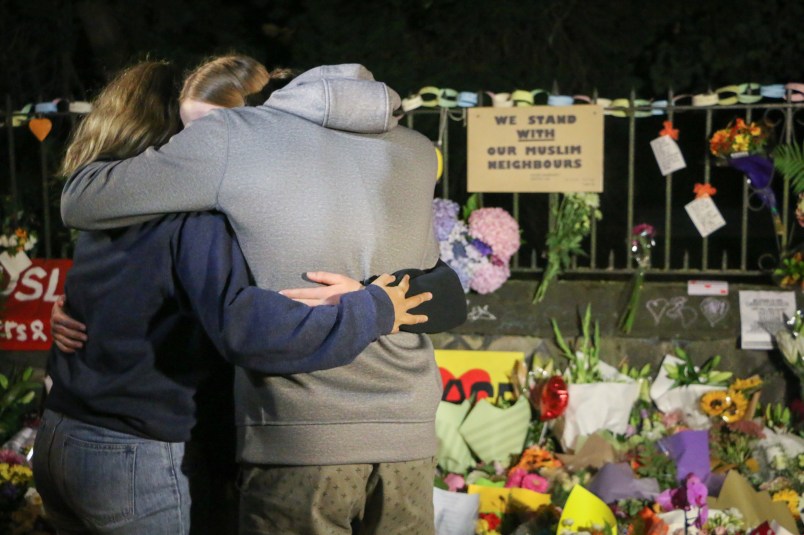 CHRISTCHURCH, CANTERBURY, NEW ZEALAND - 2019/03/17: People seen comforting themselves while paying respect to the victims of the Christchurch mosques shooting. Around 50 people has been reportedly killed in the Christchurch mosques terrorist attack shooting targeting the Masjid Al Noor Mosque and the Linwood Mosque. (Photo by Adam Bradley/SOPA Images/LightRocket via Getty Images)