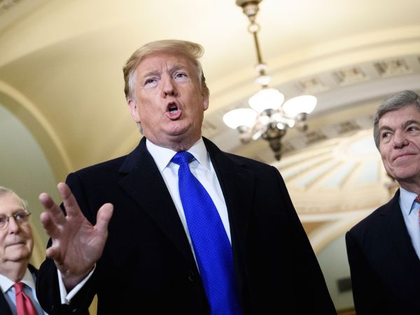 Senate Majority Leader Senator Mitch McConnell (R-KY) (L) and Senator Roy Blunt (R-MO) listens while US President Donald Trump speaks to reporters before a meeting with Senate Republicans on Capitol Hill March 26, 2019, in Washington, DC. (Photo by Brendan Smialowski / AFP)        (Photo credit should read BRENDAN SMIALOWSKI/AFP/Getty Images)