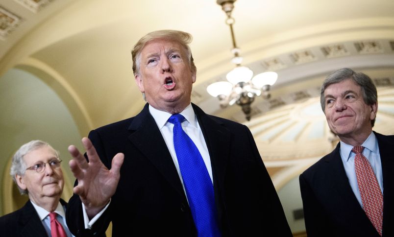 Senate Majority Leader Senator Mitch McConnell (R-KY) (L) and Senator Roy Blunt (R-MO) listens while US President Donald Trump speaks to reporters before a meeting with Senate Republicans on Capitol Hill March 26, 2019, in Washington, DC. (Photo by Brendan Smialowski / AFP)        (Photo credit should read BRENDAN SMIALOWSKI/AFP/Getty Images)