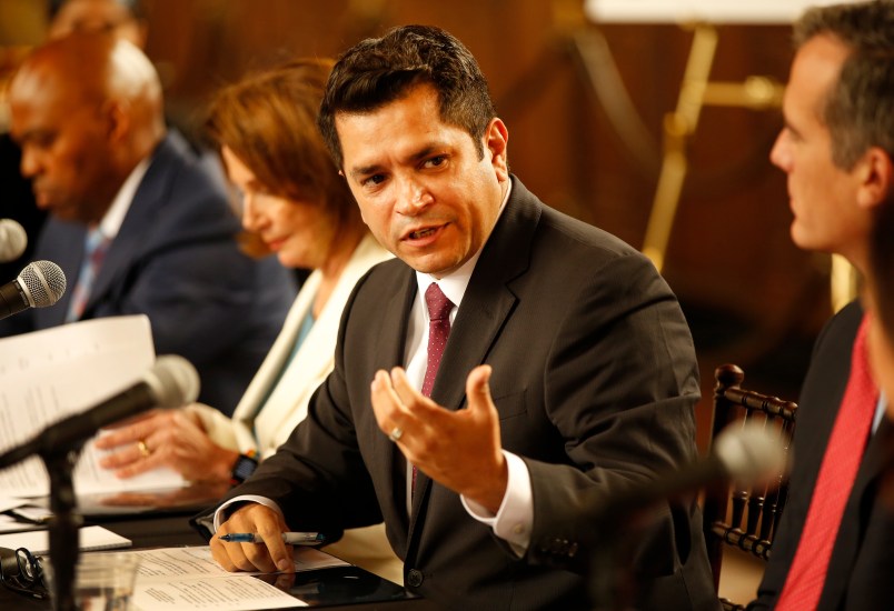 LOS ANGELES, CA â€“ AUGUST 16, 2017: Congressman Jimmy Gomez, center, with House Democratic Leader Nancy Pelosi, left and Mayor Eric Garcetti, right, talk during a conference Wednesday, August 16, 2017 at Los Angeles Union Station about the â€œBetter Dealâ€ economic agenda unveiled by House and Senate Democrats last month. (Al Seib / Los Angeles Times)