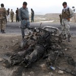 Afghan security forces gather at the site a day after an a Suicide attack near the Bagram Air Base, north of Kabul, Afghanistan, Tuesday, April 10, 2019. Three American service members and a U.S. contractor were killed when their convoy hit a roadside bomb on Monday near the main U.S. base in Afghanistan, the U.S. forces said. The Taliban claimed responsibility for the attack. (AP Photo/Rahmat Gul)