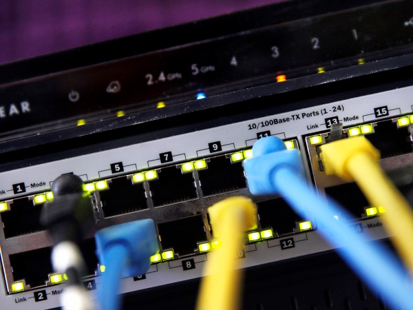 FILE- In this June 19, 2018, file photo a router and internet switch are displayed in East Derry, N.H. Net neutrality traces back to an engineering maxim called the “end-to-end principle,” a self-regulating network that put control in the hands of end users rather than a central authority. Traditional cable-TV services, for instance, required special equipment and controlled what channels are shown on TV. With an end-to-end network like the internet, the types of equipment, apps, articles and video services permitted are limited only to imagination. (AP Photo/Charles Krupa, File)