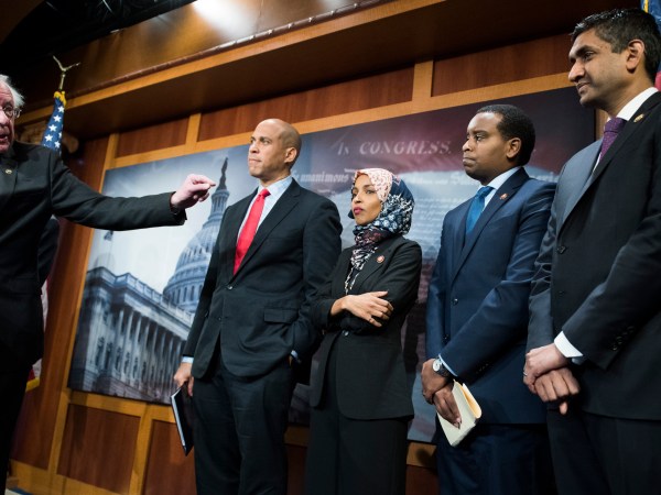 UNITED STATES - JANUARY 10: From left, Sens. Bernie Sanders, I-Vt.,  Cory Booker, D-N.J., Reps. Ilhan Omar, D-Minn., Joe Negues, D-Colo., and Ro Khanna, D-Calif., conduct a news conference in the Capitol to introduce a legislative package that would lower prescription drug prices in the U.S. on January 10, 2019. (Photo By Tom Williams/CQ Roll Call)