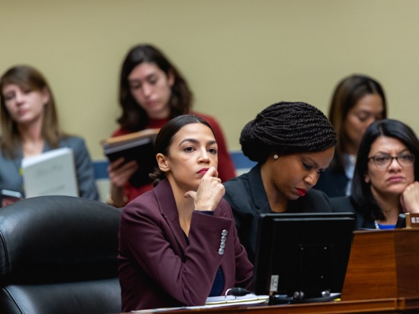 (L-R) Rep. Alexandria Ocasio-Cortez (D-NY), Rep. Ayanna Pressley (D-MA), and Rep. Rashida Tlaib (D-MI), listen as Michael Cohen, former lawyer for U.S. President Donald Trump, testifies before the House Oversight Committee on Capitol Hill, on Wednesday, February 27, 2019. (Photo by Cheriss May/NurPhoto)