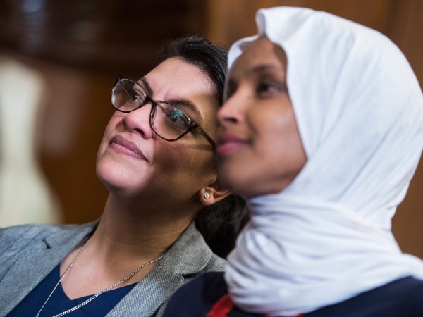 UNITED STATES - MARCH 13: Reps. Ilhan Omar, D-Minn., right, and Rashida Tlaib, D-Mich., attend a rally with Democrats in the Capitol to introduce the "Equality Act," which will amend existing civil rights legislation to bar discrimination based on gender identification and sexual orientation on Wednesday, March 13, 2019. (Photo By Tom Williams/CQ Roll Call)