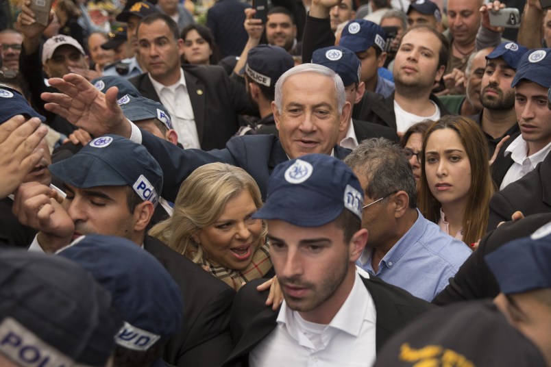 TEL AVIV, ISRAEL - APRIL 02:  Israeli Prime Minster Benjamin Netanyahu and his wife Sara Netanyahu gesture to supporters as they visit Tel Aviv's vegetable market Hatikva on April 2, 2019 in Tel Aviv, Israel.  (Photo by Amir Levy/Getty Images)