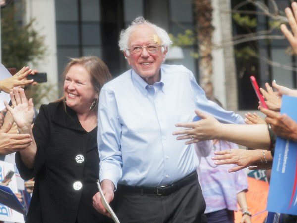 LOS ANGELES, CALIFORNIA - MARCH 23: 2020 Democratic presidential candidate U.S. Sen. Bernie Sanders (I-VT), C, arrives with his wife Jane at a campaign rally in Grand Park on March 23, 2019 in Los Angeles, California. Sanders, who is so far the top Democratic candidate in the race, is making the rounds in California which is considered a crucial 'first five' primary state by the Sanders campaign. California will hold on early primary on March 3, 2020. (Photo by Mario Tama/Getty Images)