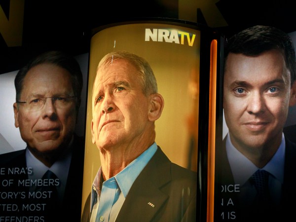 INDIANAPOLIS, INDIANA, UNITED STATES - 2019/04/27: Photos of NRA Chief Executive and Executive Vice President Wayne LaPierre, (L), former president of the NRA Oliver North (M) and chief lobbyist and principal political strategist for the Institute for Legislative Action Chris Cox (R) are on display during the during the third day of the National Rifle Association convention being held nearby. (Photo by Jeremy Hogan/SOPA Images/LightRocket via Getty Images)