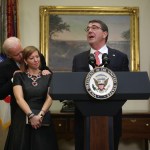 WASHINGTON, DC - FEBRUARY 17:  Ashton Carter (R) makes remarks after he was sworn in as U.S. Secretary of Defense as his wife Stephanie (2nd L)  Vice President Joe Biden (L) listen February 17, 2015 in the Roosevelt Room of the White House in Washington, DC. Carter has become the 25th U.S. Secretary of Defense.  (Photo by Alex Wong/Getty Images)