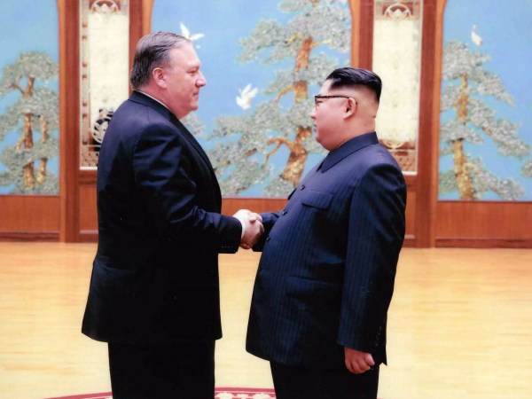 PYONGYANG, NORTH KOREA - APRIL 25: In this handout provided by The White House, CIA director Mike Pompeo shakes hands with North Korean leader Kim Jong Un in this undated image in Pyongyang, North Korea. Pompeo, now Secretary of State spoke with Kim for more than an hour during the Easter weekend. (Photo by The White House via Getty Images)