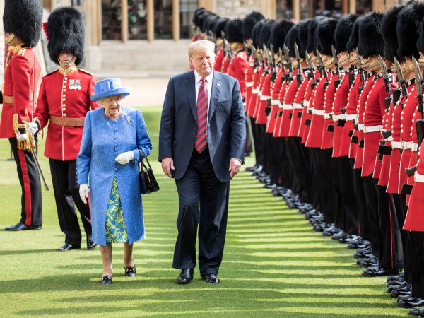 The Queen walks with President Trump as they inspect the Coldstream guards at Windsor castle.