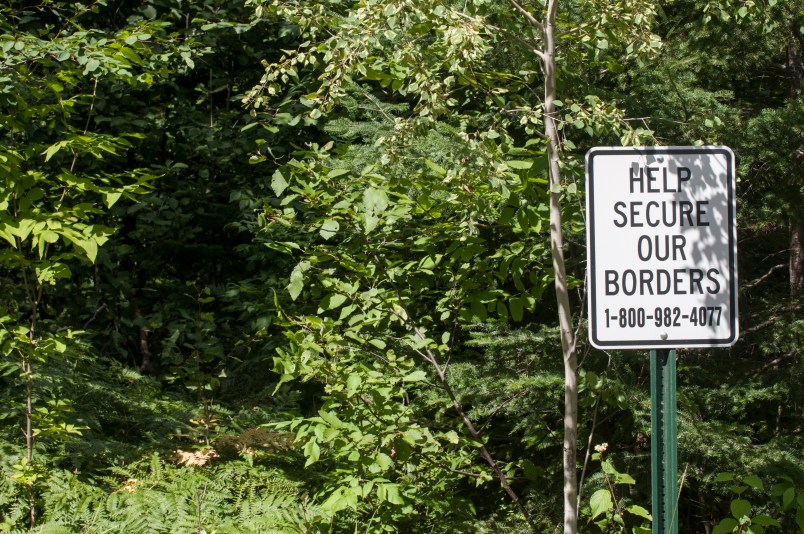 Grand Marais, Minnesota. Secure our border sign on a trail that leads to Canada through the Superior National Forest.