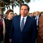 Florida Governor Ron DeSantis attends an interfaith service at Pine Trails Park in Parkland, Fla., to remember the 17 victims killed last year at Marjory Stoneman Douglas High School, on Thursday, Feb. 14, 2019. (Michael Laughlin/Sun Sentinel/TNS)