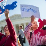 UNITED STATES - OCTOBER 03: Shirley Connuck, right, holds up a sign representing a district in Texas, as the Supreme Court hears a case on partisan gerrymandering by state legislatures on October 3, 2017. (Photo By Tom Williams/CQ Roll Call)