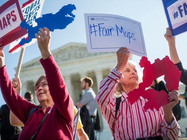 UNITED STATES - OCTOBER 03: Shirley Connuck, right, holds up a sign representing a district in Texas, as the Supreme Court hears a case on partisan gerrymandering by state legislatures on October 3, 2017. (Photo By Tom Williams/CQ Roll Call)