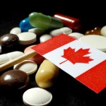 Canadian flag with lot of medical pills isolated on black background