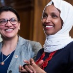 UNITED STATES - MARCH 13: Reps. Ilhan Omar, D-Minn., right, and Rashida Tlaib, D-Mich., attend a rally with Democrats in the Capitol to introduce the "Equality Act," which will amend existing civil rights legislation to bar discrimination based on gender identification and sexual orientation on Wednesday, March 13, 2019. (Photo By Tom Williams/CQ Roll Call)