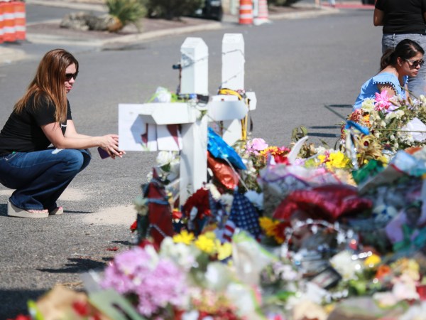 EL PASO, TX - AUGUST 15:  People gather at a makeshift memorial honoring victims outside Walmart, near the scene of a mass shooting which left at least 22 people dead, on August 15, 2019 in El Paso, Texas. A 21-year-old white male suspect remains in custody in El Paso which sits along the U.S.-Mexico border. (Photo by Sandy Huffaker/Getty Images)