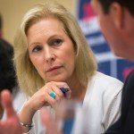 Manchester, NH, - 8/20/2019 - Senator Kirsten Gillibrand listens to Senator Tom Sherman speak during the mental health table discussion at Amoskeag Health in Manchester, N.H. on Tuesday, Aug. 20. (Nic Antaya for The Boston Globe) Topic: 21candidates