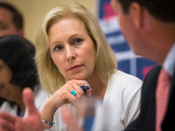 Manchester, NH, - 8/20/2019 - Senator Kirsten Gillibrand listens to Senator Tom Sherman speak during the mental health table discussion at Amoskeag Health in Manchester, N.H. on Tuesday, Aug. 20. (Nic Antaya for The Boston Globe) Topic: 21candidates