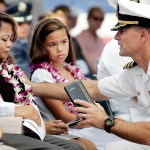 PEARL HARBOR, HI - JULY 11:  During a memorial service held at the National Memorial Cemetery of the Pacific in Honolulu, Naval Rear Admiral Joseph Maguire, Commander of the Naval Special Warfare Command (right) presents an award post humorously to Norminda Healy, wife of Daniel Richard Healy, a navy SEAL killed in action while conducting combat operations in Afghanistan, July 11, 2005.   (Photo by Marco Garcia/Getty Images)