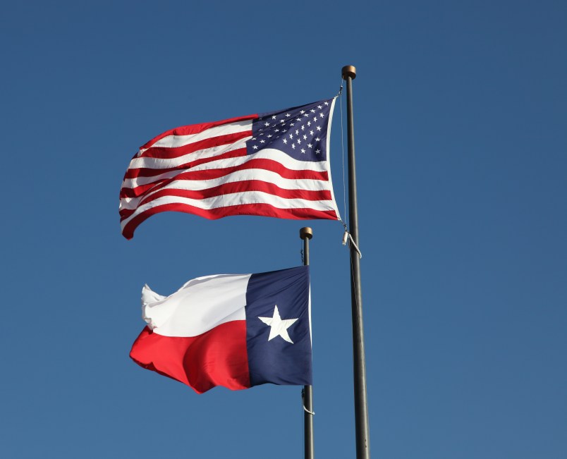 American flag and Texas flag flying at the  LBJ Library in Austin.