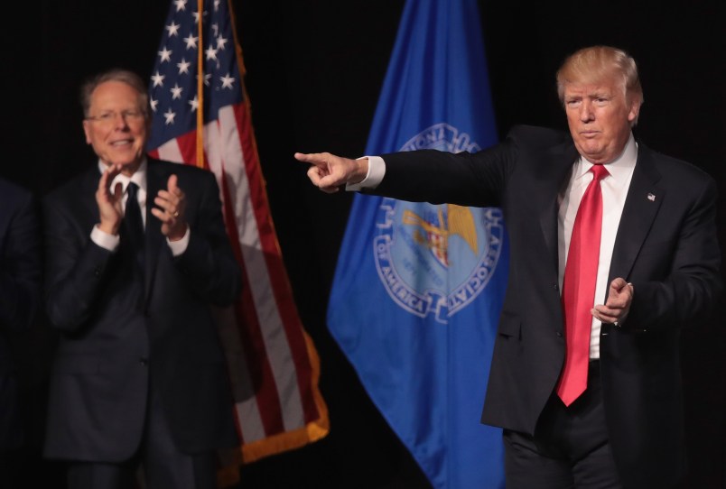 ATLANTA, GA - APRIL 28:  President Donald Trump is applauded by Wayne LaPierre (L),  executive vice president and CEO of the NRA, during the NRA-ILA's Leadership Forum at the 146th NRA Annual Meetings & Exhibits on April 28, 2017 in Atlanta, Georgia. The convention is the largest annual gathering for the NRA's more than 5 million members. Trump is the first president to address the annual meetings since Ronald Reagan.  (Photo by Scott Olson/Getty Images)