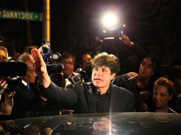 Former Illinois Gov. Rod Blagojevich waves to the crowd in front of his home as he leaves for prison on March 15, 2012, in Chicago. On Tuesday, April 18, 2017, Blagojevich's lawyers repeated assertions that federal prosecutors are clearly wrong when it comes to the ex-governor's alleged crimes. (William DeShazer/Chicago Tribune/TNS)