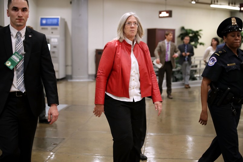 Federal Bureau of Investigation Director Christopher Wray and Director of National Intelligence Daniel Coats arrive to brief members of the so-called 'Gang of Eight' at the U.S. Capitol May 24, 2018 in Washington, DC. The bipartisan group of senators and representatives requested a briefing from the intelligence officials about the FBI's use of a confidential intelligence source in the Russia investigation. The "Gang of Eight" consists of the top Republican and Democratic members of the House and Senate intelligence committee as well as congressional leaders from both parties.