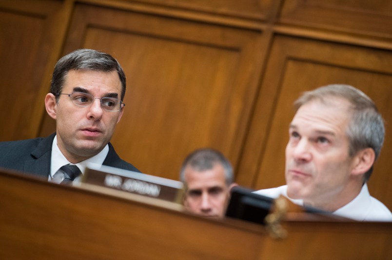 UNITED STATES - JUNE 12: Reps. Justin Amash, R-Mich., left, and ranking member Rep. Jim Jordan, R-Ohio, are seen during a House Oversight and Reform Committee markup in Rayburn Building on a resolution on whether to hold Attorney General William Barr and the Secretary of Commerce Wilbur Ross in contempt of Congress on Wednesday, June 12, 2019. (Photo By Tom Williams/CQ Roll Call)