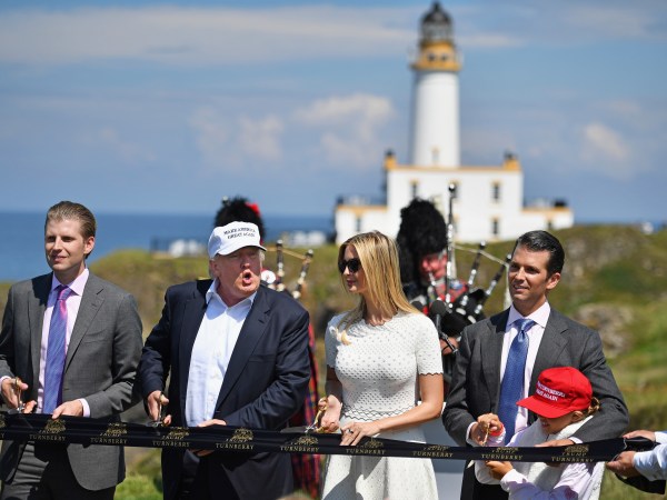 AYR, SCOTLAND - JUNE 24:  Presumptive Republican nominee for US president Donald Trump cuts a ribbon on the 9th tee at his Trump Turnberry Resort surrounded by his family Eric Trump, Ivanka Trump, Donald Trump junior and granddaughter Kai Trump on June 24, 2016 in Ayr, Scotland. Mr Trump arrived to officially open his golf resort which has undergone an eight month refurbishment as part of an investment thought to be worth in the region of two hundred million pounds.  (Photo by Jeff J Mitchell/Getty Images)