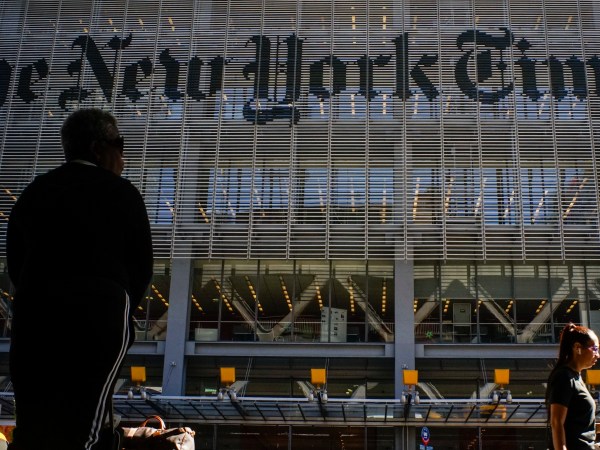 NEW YORK, USA - October 14: People walk along 8av as the New York Times building is seen at the background on October 14, 2019 in New York, USA. NY Times on Sunday evening, published a story titled, "Macabre Video of Fake Trump Shooting Media and Critics Is Shown at His Resort." The video showed the president as a mass shooter where he is executing media and his political opponents inside church. It was dysplayed at a pro Trump conference in Miami. NY Times is an American newspaper based in New York City with worldwide influence,  the paper has won 127 Pulitzer Prizes,  being ranked 18th in the world by circulation.(Photo by Eduardo MunozAlvarez/VIEWpress/Corbis via Getty Images)