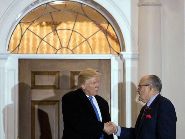 BEDMINSTER TOWNSHIP, NJ - NOVEMBER 20: (L to R) President-elect Donald Trump and former New York City mayor Rudy Giuliani shake hands following their meeting at Trump International Golf Club, November 20, 2016 in Bedminster Township, New Jersey. Trump and his transition team are in the process of filling cabinet and other high level positions for the new administration. (Photo by Drew Angerer/Getty Images)