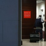 A person leaving the secure offices of the House Intelligence Committee bolts upstairs after a six-page memo alleging misconduct by senior FBI officials investigating President Donald Trump's 2016 campaign was released to the public February 2, 2018 in Washington, DC. Assembled by Committee staff of House Intelligence Committee Chairman Devin Nunes (R-CA), the formerly classified memo alleging FBI misconduct was released to the public Friday with permission from President Donald Trump.