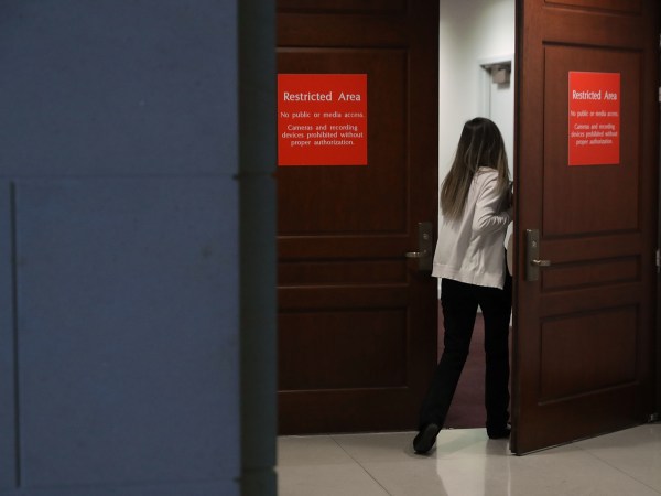 A person leaving the secure offices of the House Intelligence Committee bolts upstairs after a six-page memo alleging misconduct by senior FBI officials investigating President Donald Trump's 2016 campaign was released to the public February 2, 2018 in Washington, DC. Assembled by Committee staff of House Intelligence Committee Chairman Devin Nunes (R-CA), the formerly classified memo alleging FBI misconduct was released to the public Friday with permission from President Donald Trump.