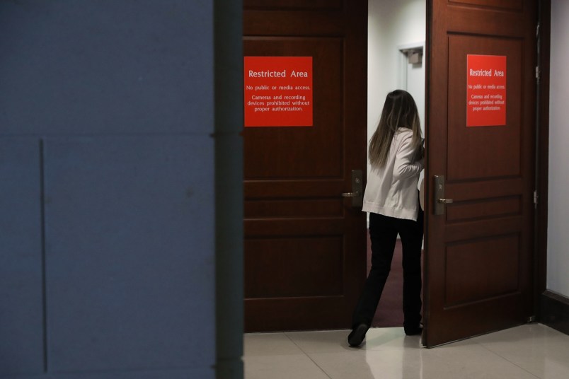 A person leaving the secure offices of the House Intelligence Committee bolts upstairs after a six-page memo alleging misconduct by senior FBI officials investigating President Donald Trump's 2016 campaign was released to the public February 2, 2018 in Washington, DC. Assembled by Committee staff of House Intelligence Committee Chairman Devin Nunes (R-CA), the formerly classified memo alleging FBI misconduct was released to the public Friday with permission from President Donald Trump.