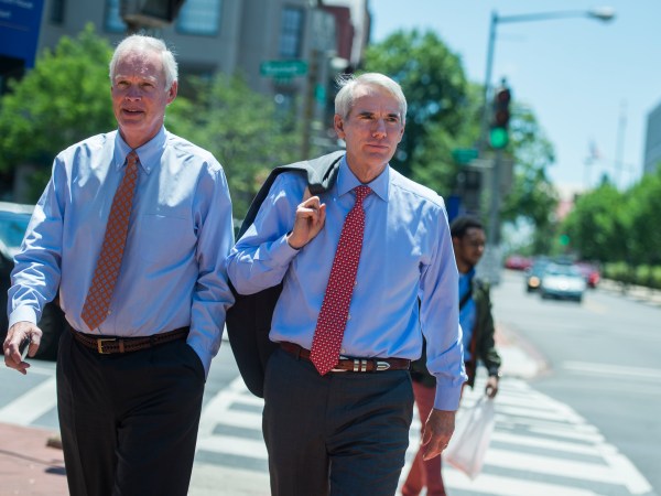 UNITED STATES - JUNE 12: Sens. Rob Portman, R-Ohio, right, and Ron Johnson R-Wis., arrive for the Republican Senate Policy luncheon at the National Republican Senatorial Committee on June 12, 2018. (Photo By Tom Williams/CQ Roll Call)