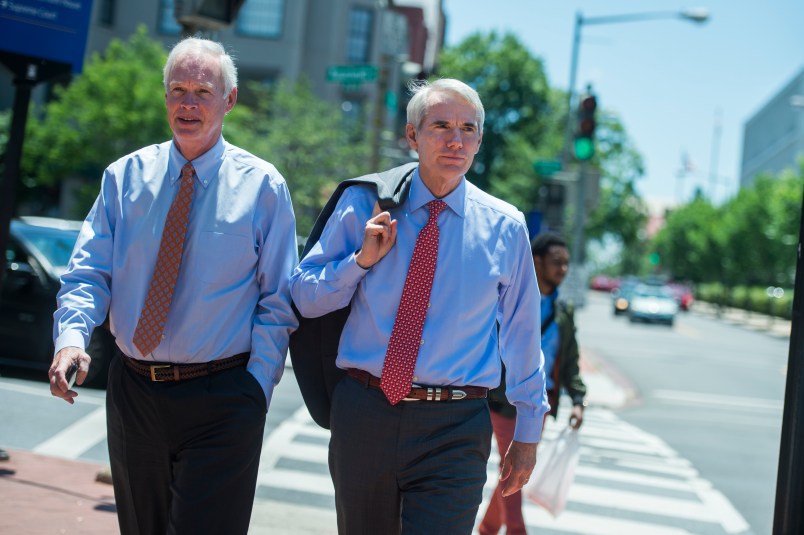 UNITED STATES - JUNE 12: Sens. Rob Portman, R-Ohio, right, and Ron Johnson R-Wis., arrive for the Republican Senate Policy luncheon at the National Republican Senatorial Committee on June 12, 2018. (Photo By Tom Williams/CQ Roll Call)