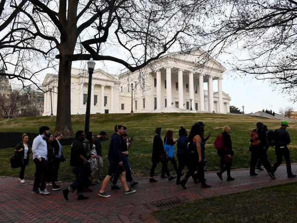 RICHMOND, VA - FEBRUARY 7:Protesters walk in front of the Virginia State Capitol February 07, 2019 in Richmond, VA. The top three Democrats in the Virginia legislature, Virginia’s Gov. Ralph Northam, Lt. Gov. Justin Fairfax and Attorney General Mark R. Herring are plagued by scandals and facing calls to resign. (Photo by Katherine Frey/The Washington Post)