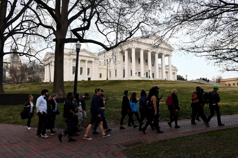 RICHMOND, VA - FEBRUARY 7:Protesters walk in front of the Virginia State Capitol February 07, 2019 in Richmond, VA. The top three Democrats in the Virginia legislature, Virginia’s Gov. Ralph Northam, Lt. Gov. Justin Fairfax and Attorney General Mark R. Herring are plagued by scandals and facing calls to resign. (Photo by Katherine Frey/The Washington Post)