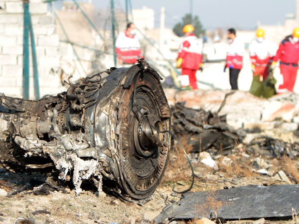 TEHRAN, IRAN - 2020/01/08: Rescue team at the crash site of a Ukrainian airliner that burst into flames shortly after take-off from Tehran on Wednesday, killing all 176 people aboard in a crash. (Photo by Mazyar Asadi/Pacific Press/LightRocket via Getty Images)