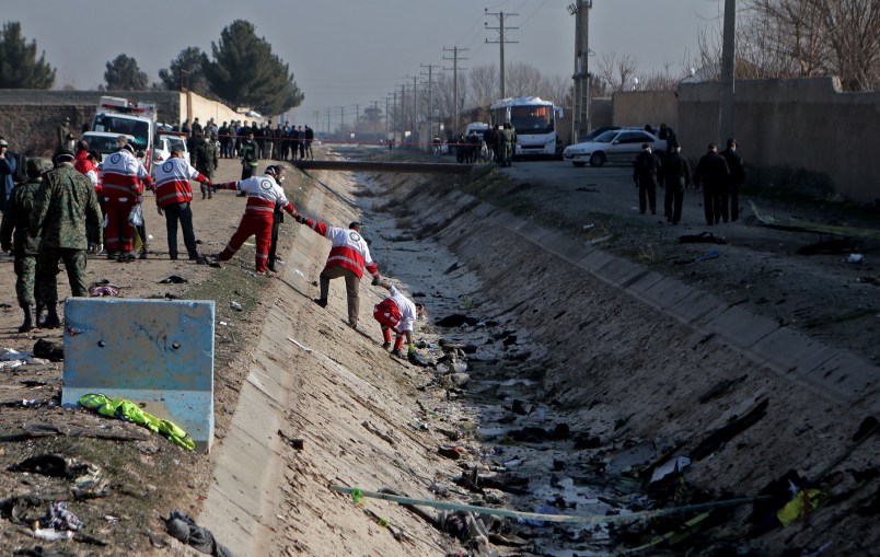 TEHRAN, Jan. 8, 2020 -- Rescuers work at the air crash site of a Boeing 737 Ukrainian passenger plane in Parand district, southern Tehran, Iran, on Jan. 8, 2020. All the passengers and crew members on board the Boeing 737 Ukrainian passenger plane that crashed near Tehran Imam Khomeini International Airport on Wednesday morning are confirmed dead, official Islamic Republic News Agency reported. (Photo by Ahmad Halabisaz/Xinhua via Getty)