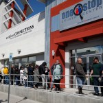 People wait in line for help with unemployment benefits at the One-Stop Career Center, Tuesday, March 17, 2020, in Las Vegas. Nevada Department of Employment, Training and Rehabilitation and it’s partner organizations, like the One-Stop Career Center, have seen an increase in traffic due to the coronavirus. (AP Photo/John Locher)