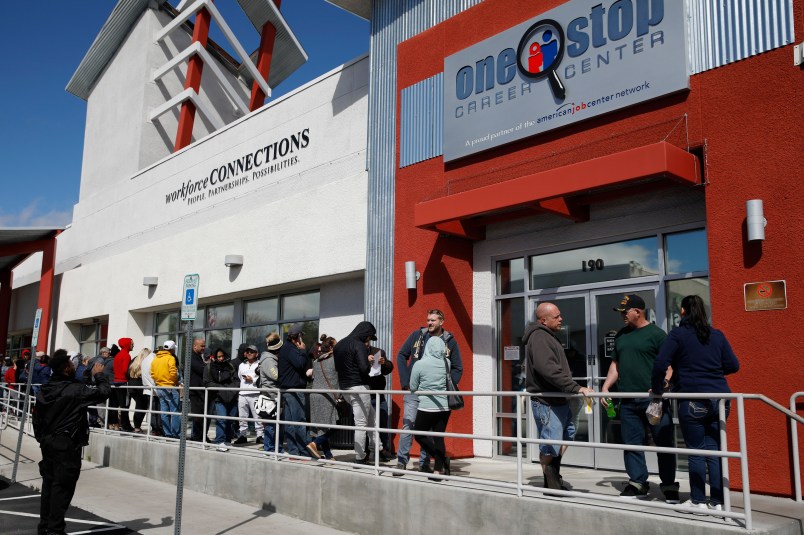 People wait in line for help with unemployment benefits at the One-Stop Career Center, Tuesday, March 17, 2020, in Las Vegas. Nevada Department of Employment, Training and Rehabilitation and it’s partner organizations, like the One-Stop Career Center, have seen an increase in traffic due to the coronavirus. (AP Photo/John Locher)