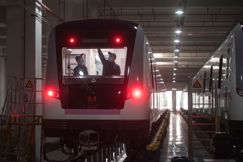 In this March 23, 2020 photo released by Xinhua News Agency, workers prepares a subway train for restoration of public transport in Wuhan, in central China's Hubei province. China's health ministry says Wuhan has now gone several consecutive days without a new infection, showing the effectiveness of draconian travel restrictions that are slowly being relaxed around the country.  (Xiao Yijiu/Xinhua via AP)